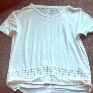 Cute white T-shirt with designs on the bottom